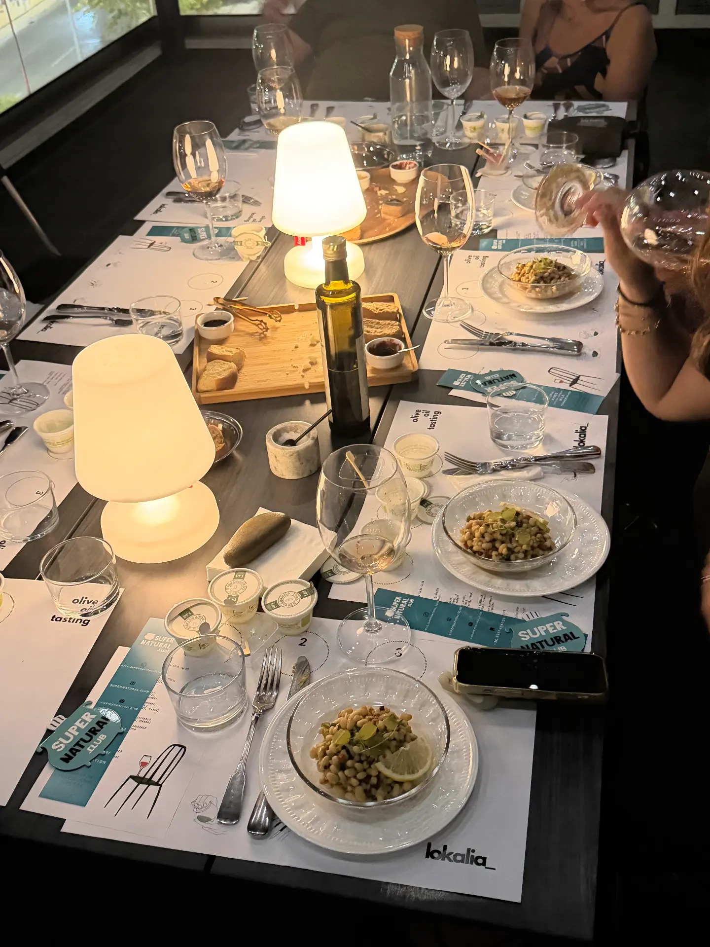 dinner plates and tasting glasses around the table