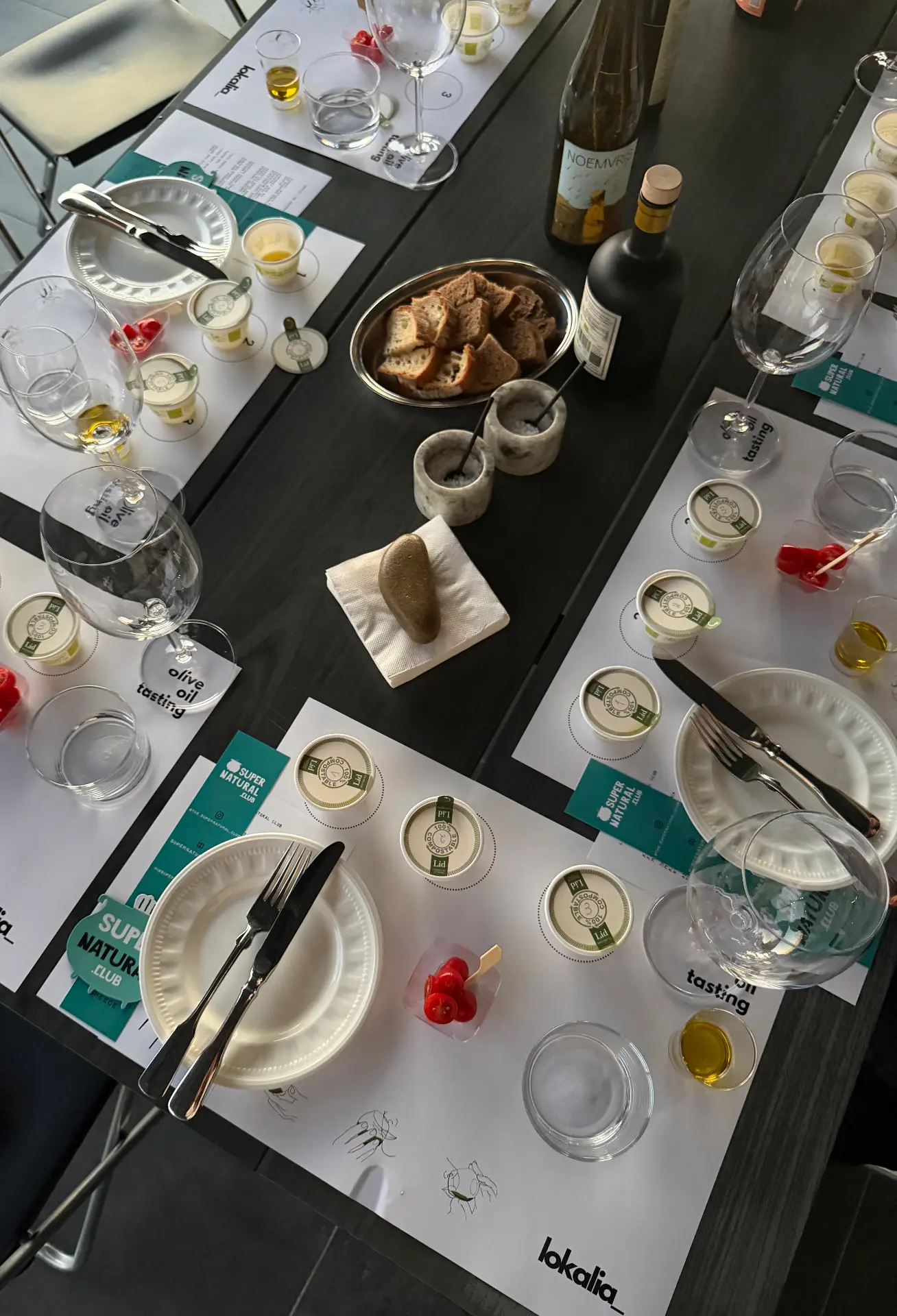 olive oil tasting places laid out with bread and glasses