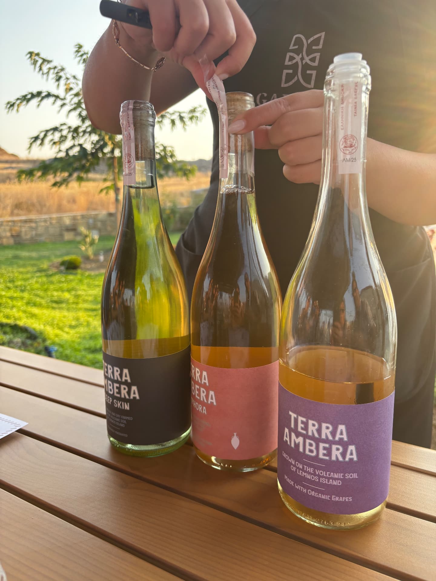 Terra Ambera wines from Lemnos being opened at golden hour