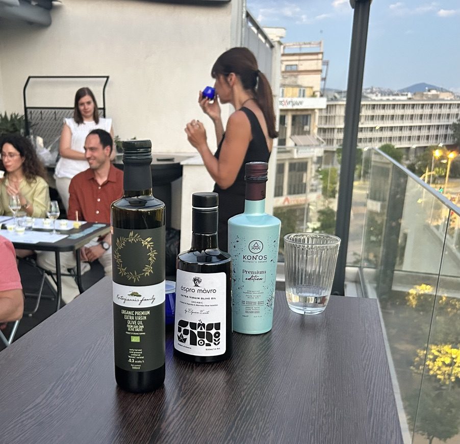 olive oil and natural wine bottles lined up for the tasting