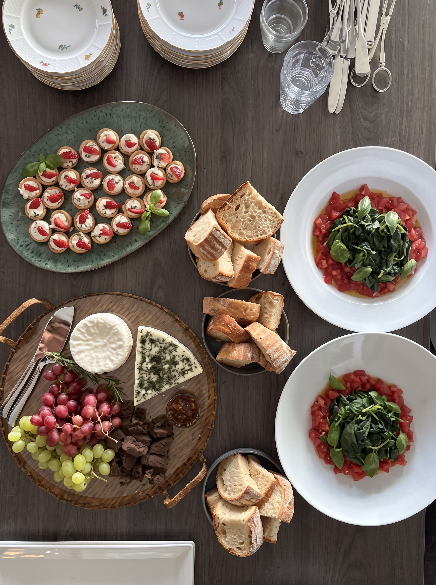 meze boards, bread and tomato dishes laid out from above