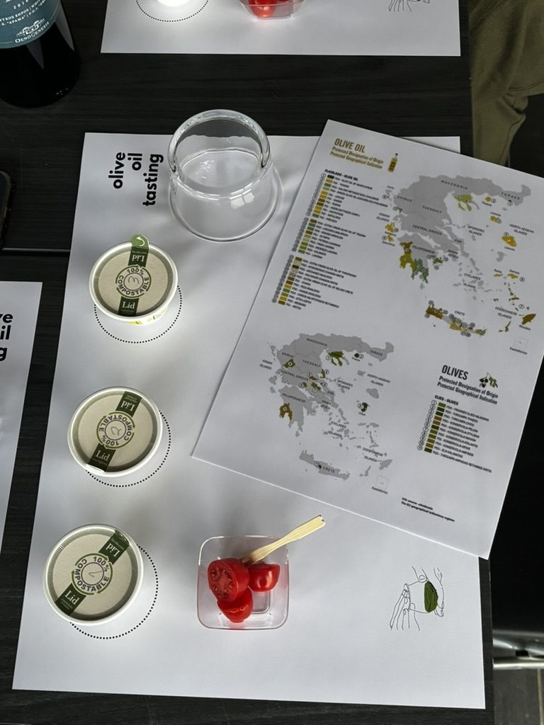 olive oil tasting glasses on the printed tasting map