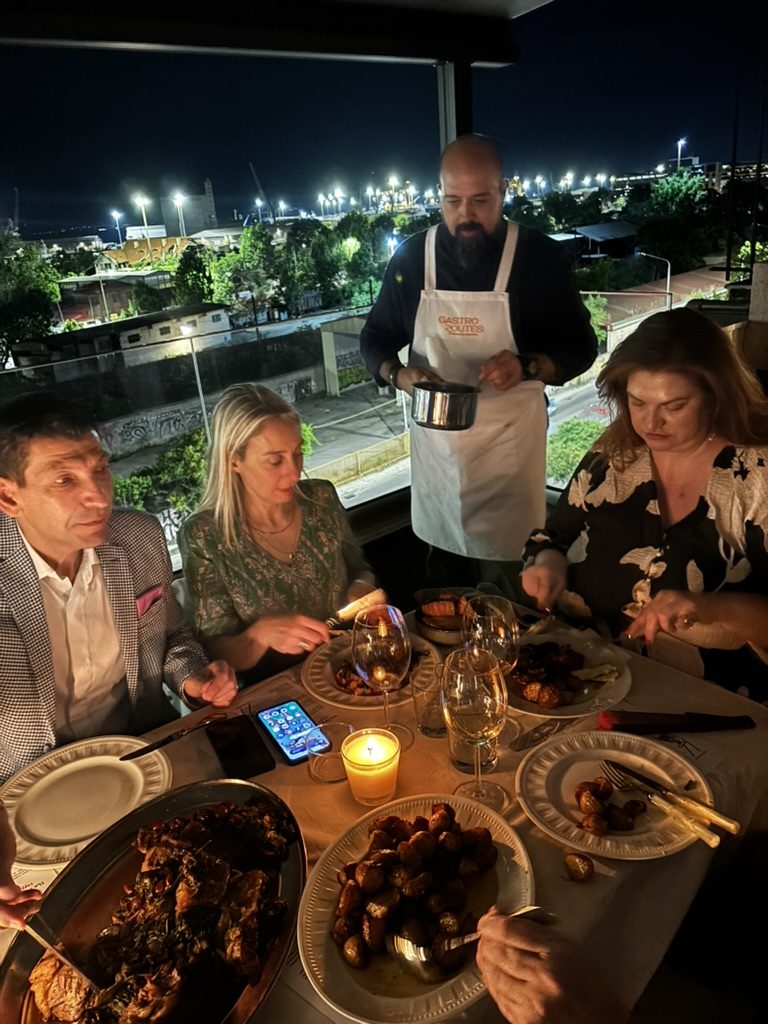 wine being poured for guests at the table after dark