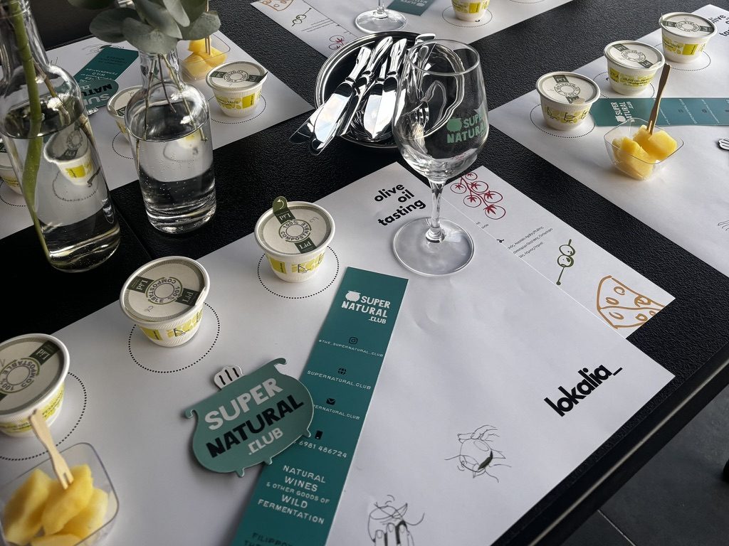 tasting glasses and printed notes set at each place