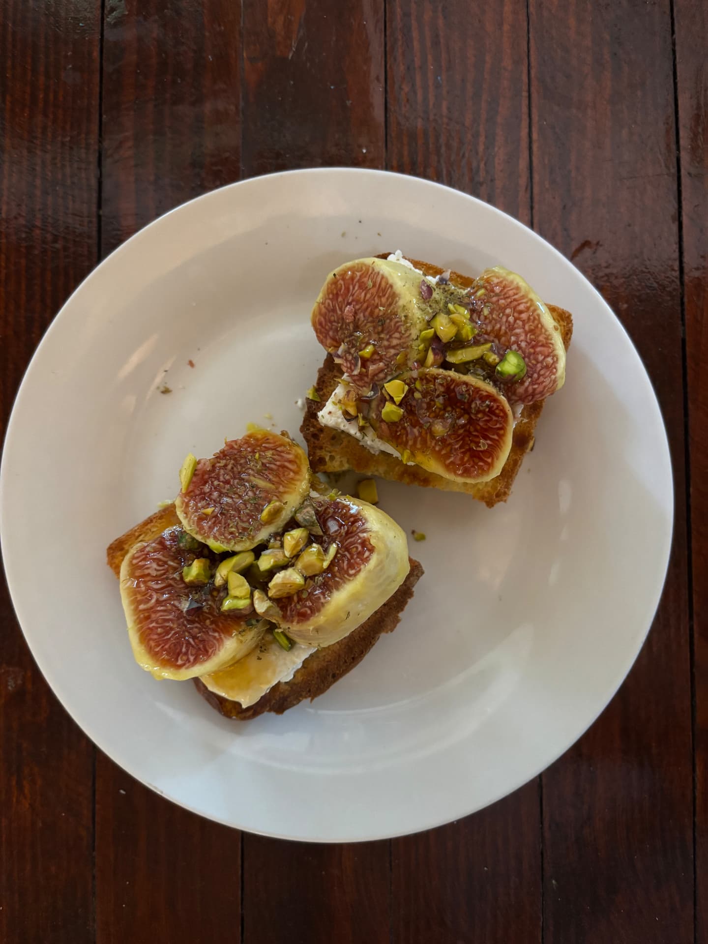 fresh figs on sourdough with cheese, honey and pistachio